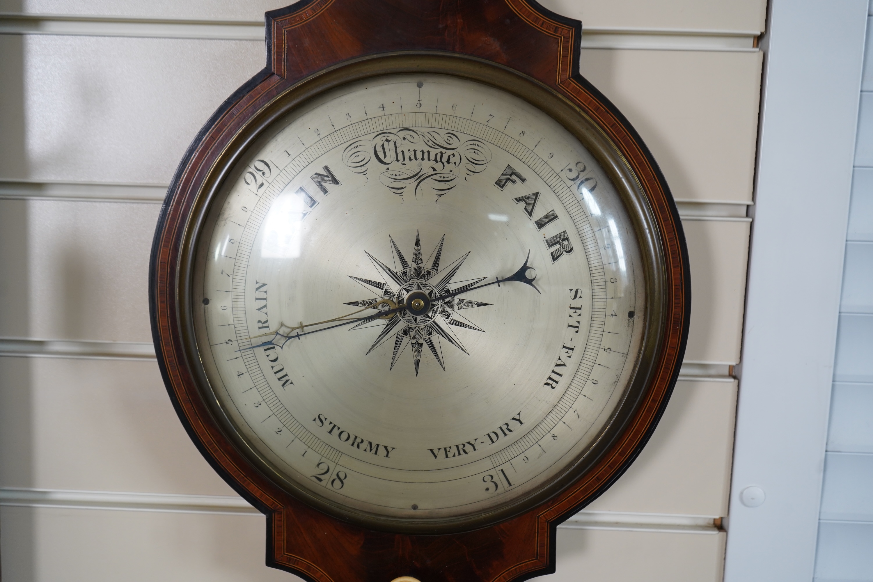 A large mid 19th century tulipwood banded mahogany wheel barometer, by C. Rimondi, Halifax